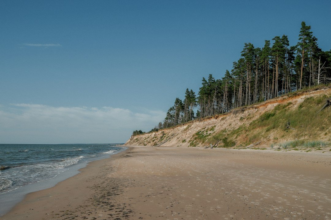 A high coastal cliff and beach beside the Baltic Sea