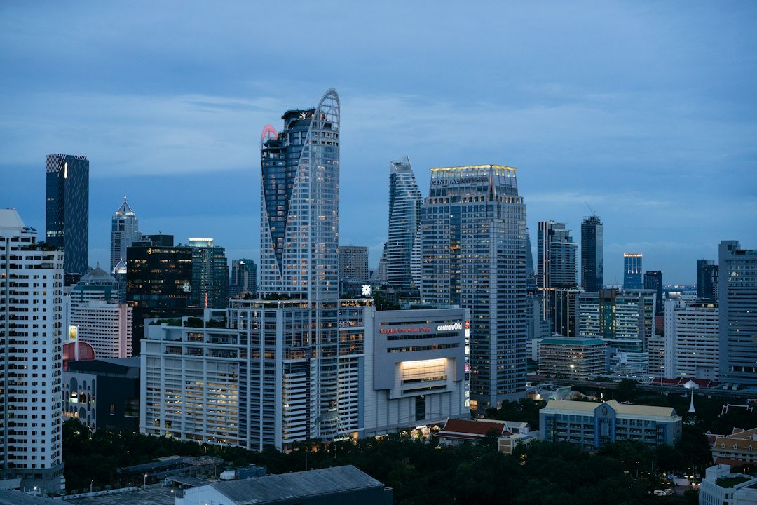 City skyline at night, illustrative image accompanying an IMF economic outlook report