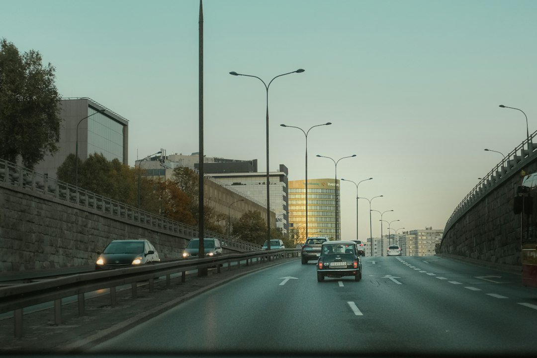 A car travelling on an urban motorway illustrating assisted-driving technology